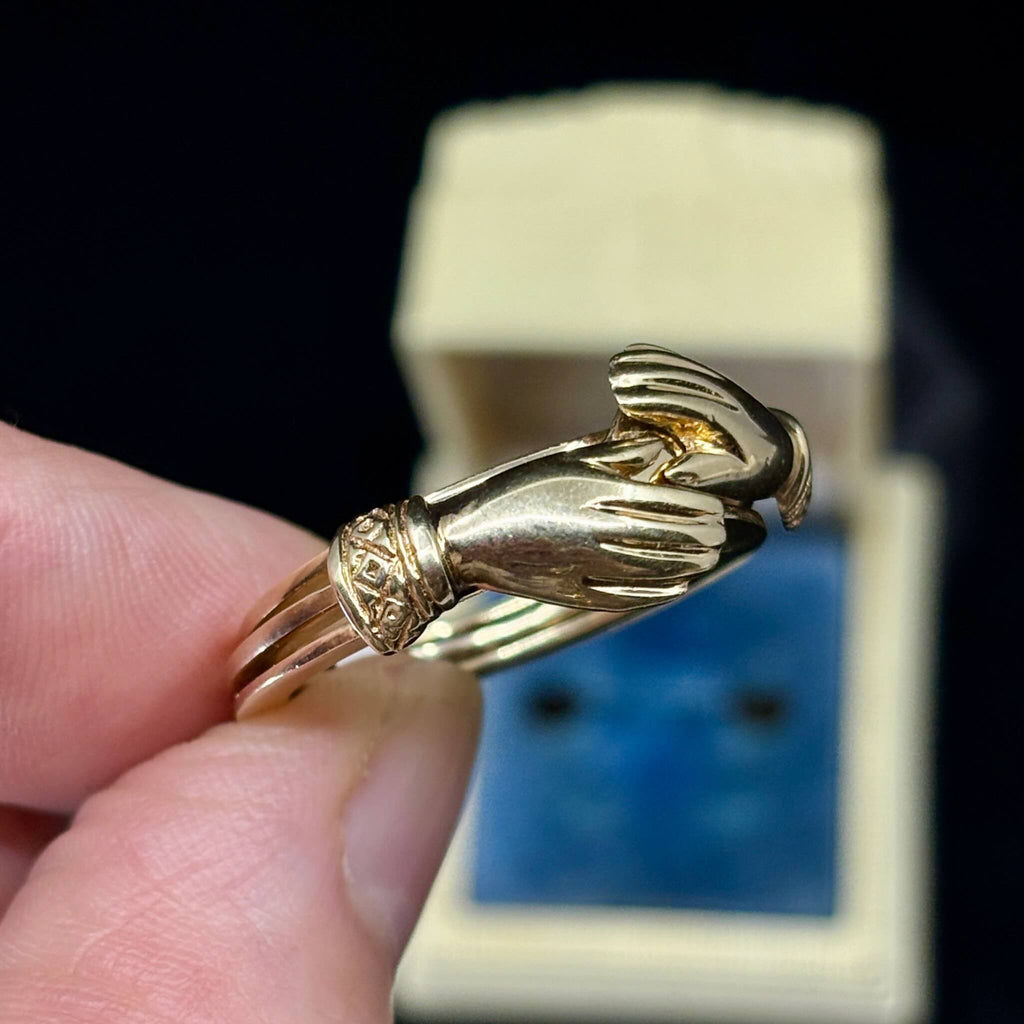 Detailed side profile of Victorian gimmel ring showing engraved cuffs and split band.