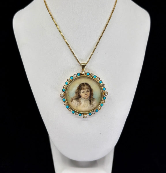 Close-up of hand-painted portrait miniature on ivory set in a 15ct gold Victorian locket framed by turquoise and natural pearls