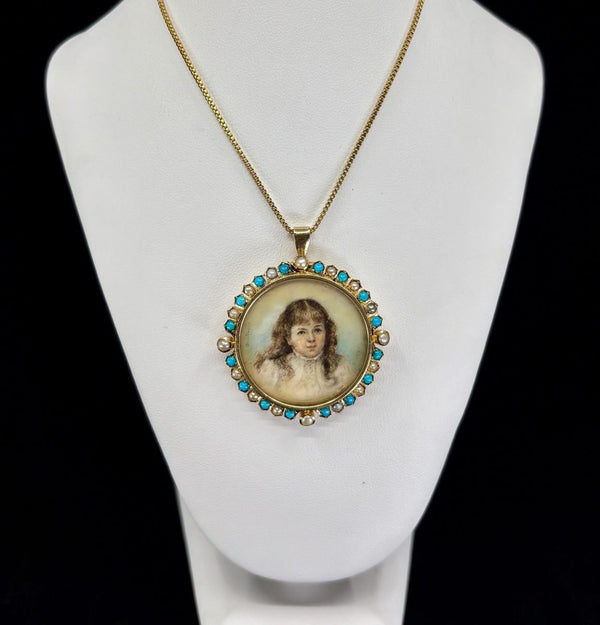 Close-up of hand-painted portrait miniature on ivory set in a 15ct gold Victorian locket framed by turquoise and natural pearls