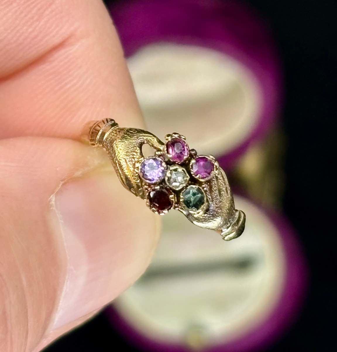 Victorian Regard ring featuring a gemstone cluster spelling "REGARD" with Fede design.