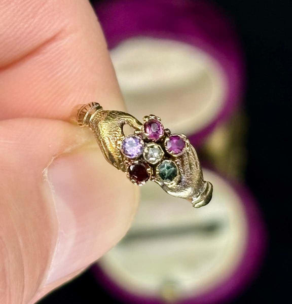 Victorian Regard ring featuring a gemstone cluster spelling "REGARD" with Fede design.