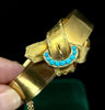 Victorian turquoise buckle gold bangle circa 1860 shown in hand to illustrate size and oval form