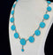 Side view of a Victorian turquoise necklace showcasing graduated round domed links in mint condition.