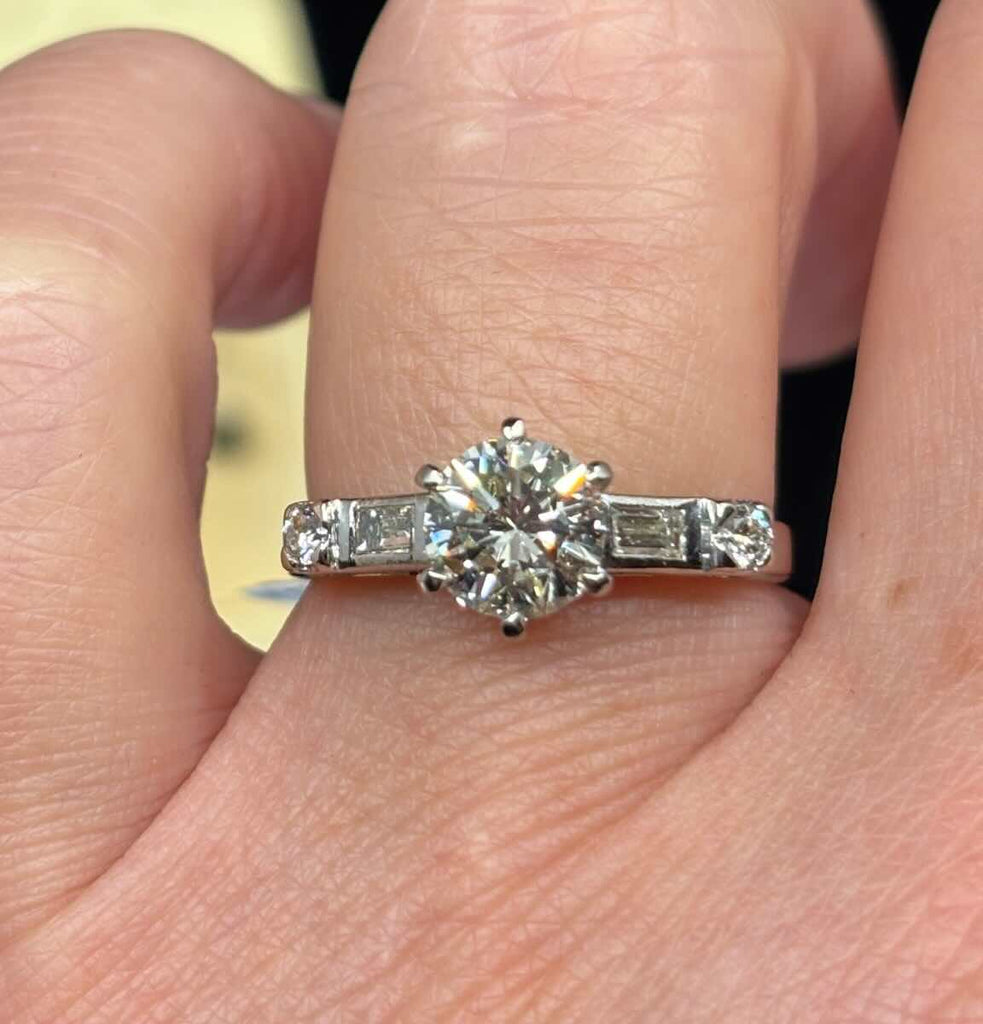  Vintage 1950s brilliant cut diamond engagement ring worn on finger, shows size, sparkle and tapered 2.7–1.9mm 18ct white gold band.