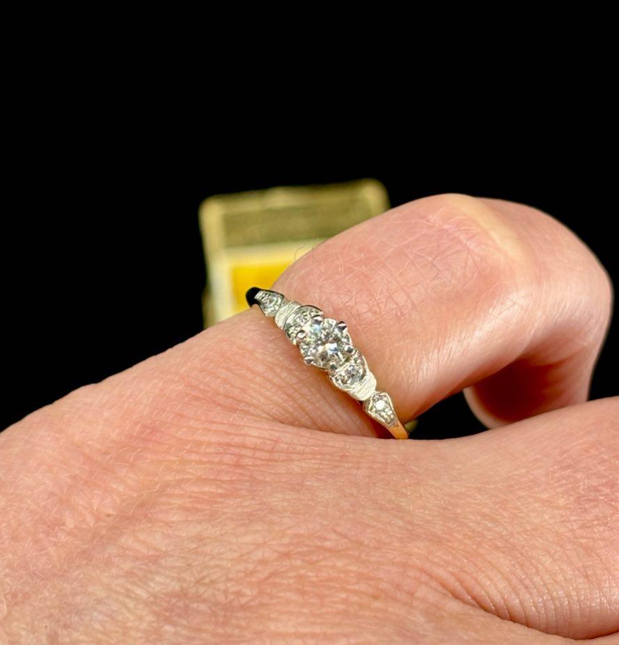 Handmade 1960s round brilliant cut diamond engagement ring in platinum and 18ct yellow gold.