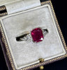 Vintage 2.83ct untreated ruby ring showing vivid saturated colour, low looped gallery and fine half‑round parallel shank, ideal collectible gemstone ring.
