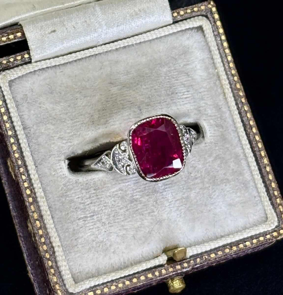 Vintage 2.83ct untreated ruby ring showing vivid saturated colour, low looped gallery and fine half‑round parallel shank, ideal collectible gemstone ring.