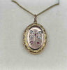 Vintage 9ct yellow gold locket showcasing a beautiful bow motif, emblematic of the Victorian era.