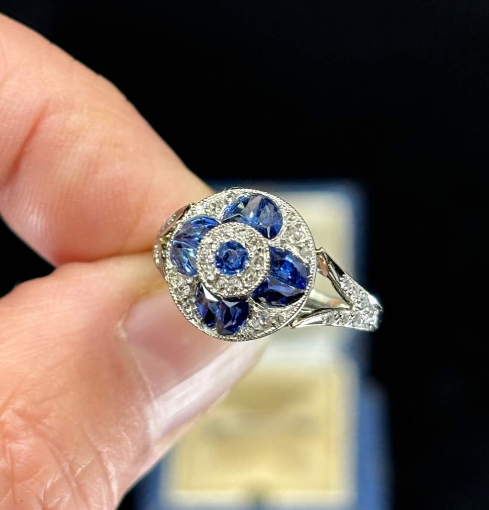vintage Ceylon sapphire cluster engagement ring with split shoulders to a 1.80mm band.