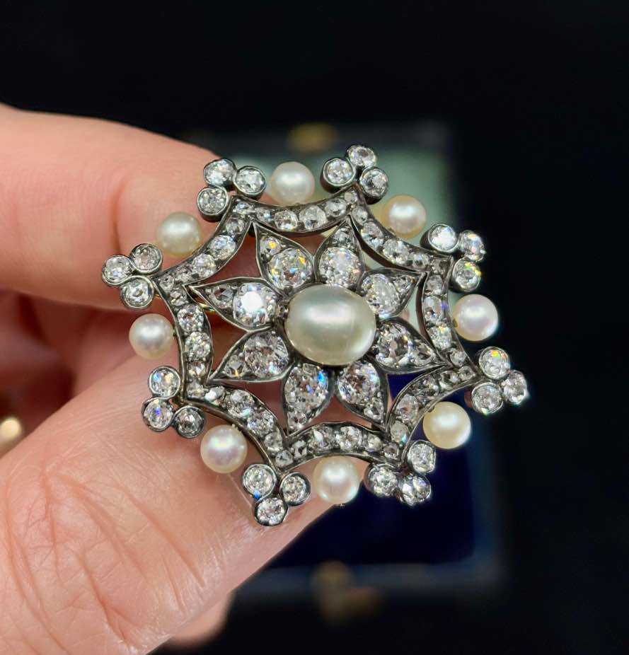 Victorian pearl and diamond brooch showcasing 15ct yellow gold.