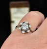 Vintage diamond engagement ring from the 1940s with black enamel border.