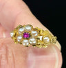 Vintage floral engraved ring with central ruby and pearls.