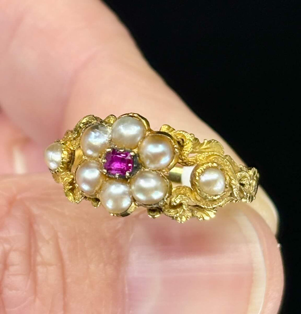 Vintage floral engraved ring with central ruby and pearls.