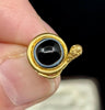 Antique Victorian banded onyx snake earring shown worn on ear to display scale, elegance and everyday wearability.