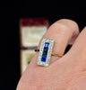 Side profile of a vintage Art Deco ring featuring sapphires and diamonds in a rectangular cluster setting.