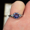 Vintage engagement ring with Ceylon sapphire and brilliant cut diamond shoulders in 18ct white gold