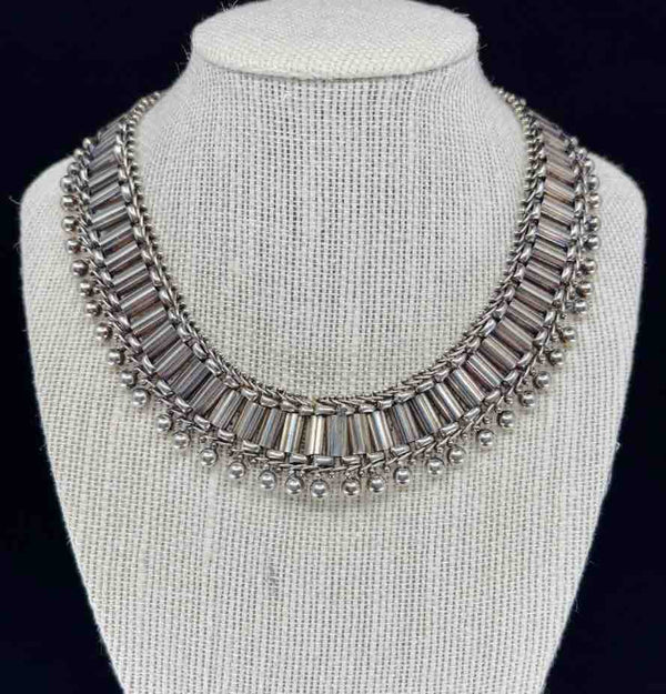 Front view of a Victorian Sterling silver collar necklace from circa 1870, showcasing intricate beadwork and chain links.