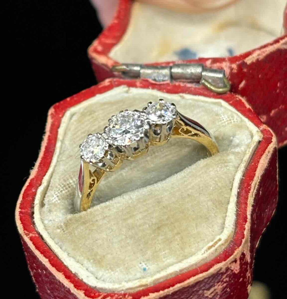 Vintage three-stone diamond ring set in platinum with 18ct yellow gold shank, approx. 0.30ct centre and 0.22ct sides.